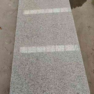 自贡芝麻白光面毛板