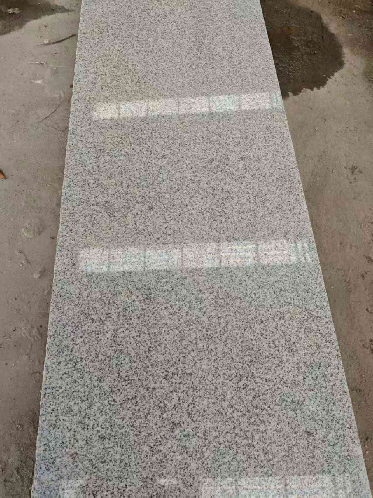 自贡芝麻白光面毛板